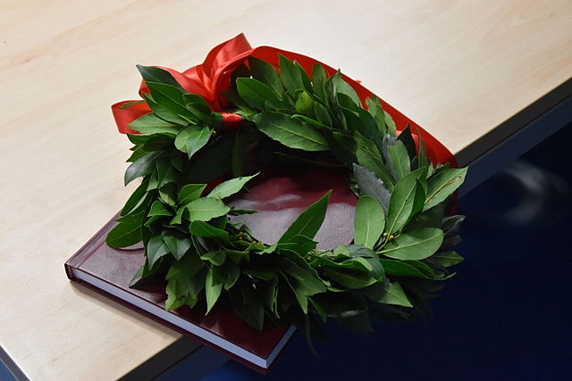 Laurel wreath with a red ribbon for a graduate student
