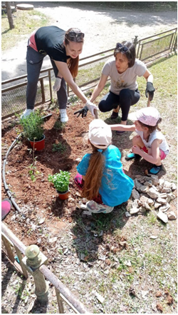Children from Ukraine participate in a hands-on garden day as part of HWB events