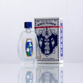 Clear bottle, and blue and white box of White Flower Oil